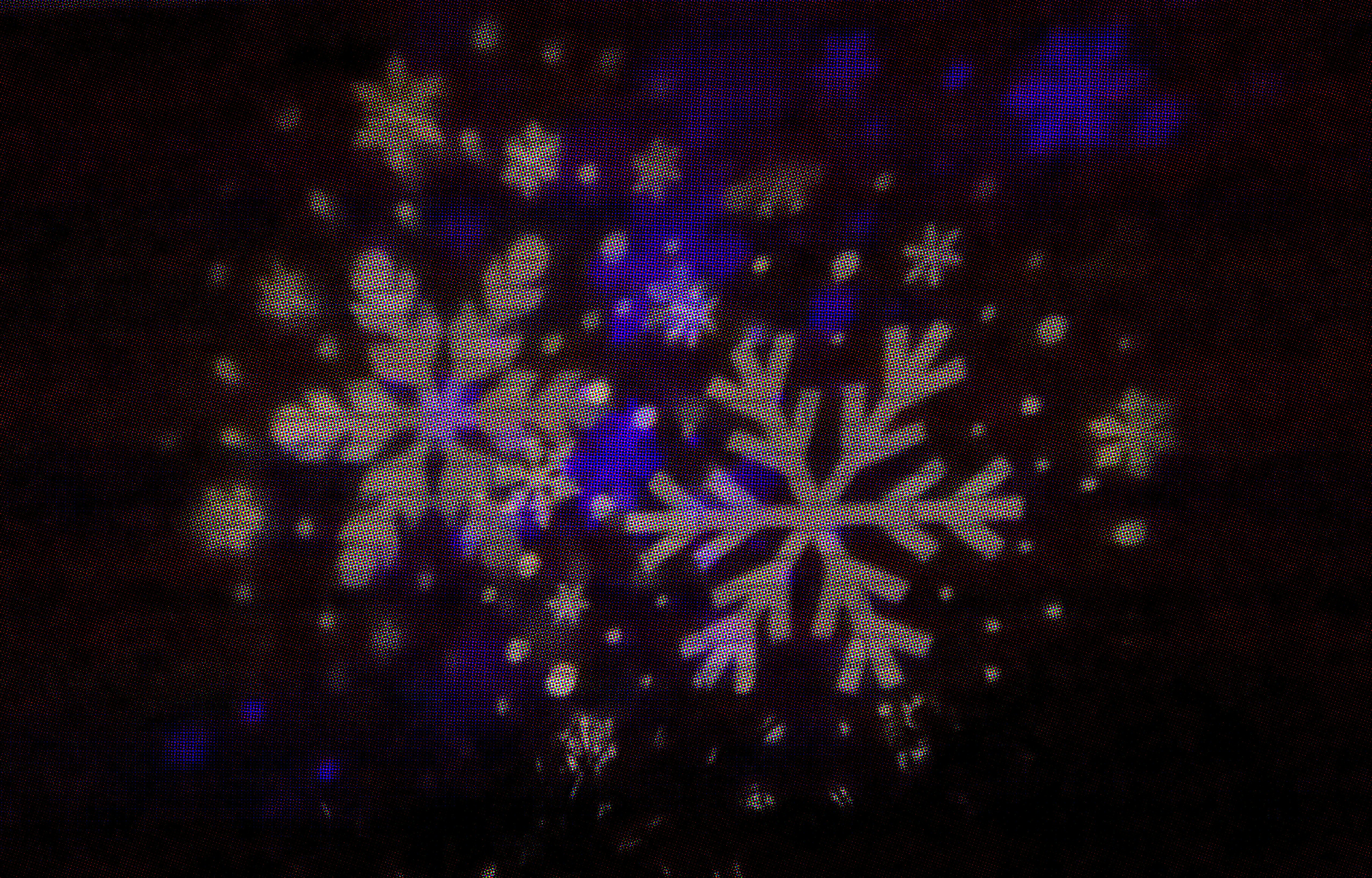 a snowflake is shown on a screen in the dark