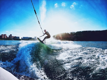 Group of friends enjoying wakeboarding and wakesurfing on a sunny day at the Wiking Yacht Club Marina.