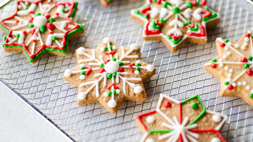 a tray of decorated cookies on a cooling rack