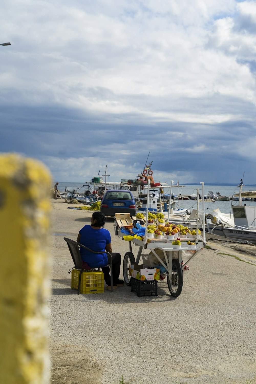 a man sitting at a table near the ocean