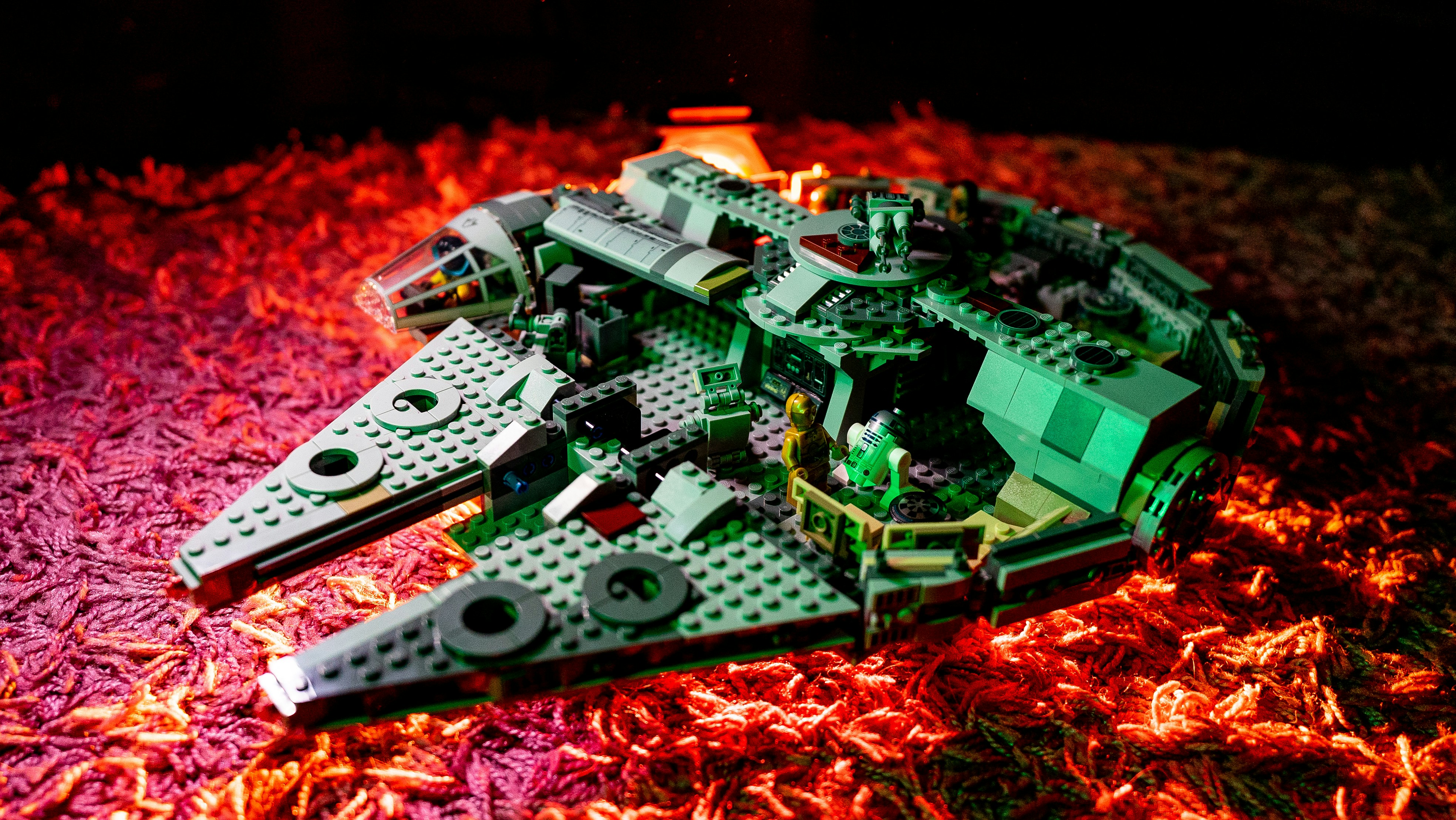 a lego model of a star destroyer on a bed of grass