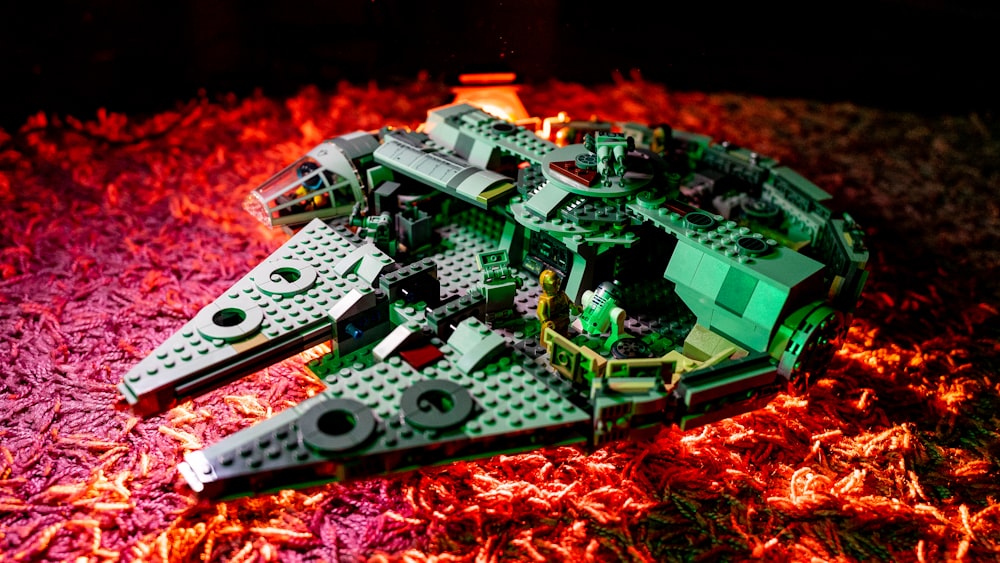 a lego model of a star destroyer on a bed of grass