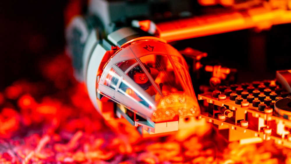 a close up of a machine with a red light on it