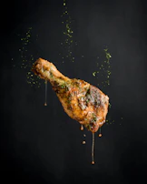 a piece of meat with sprinkles on it