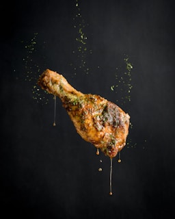 a piece of meat with sprinkles on it