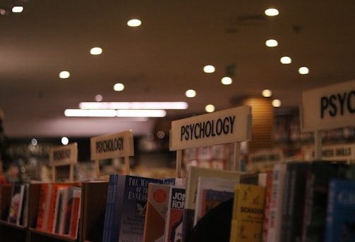 a row of books on a shelf in a library