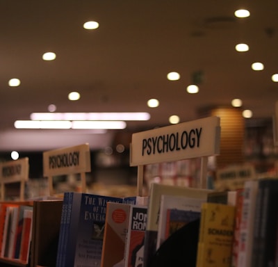 a row of books on a shelf in a library