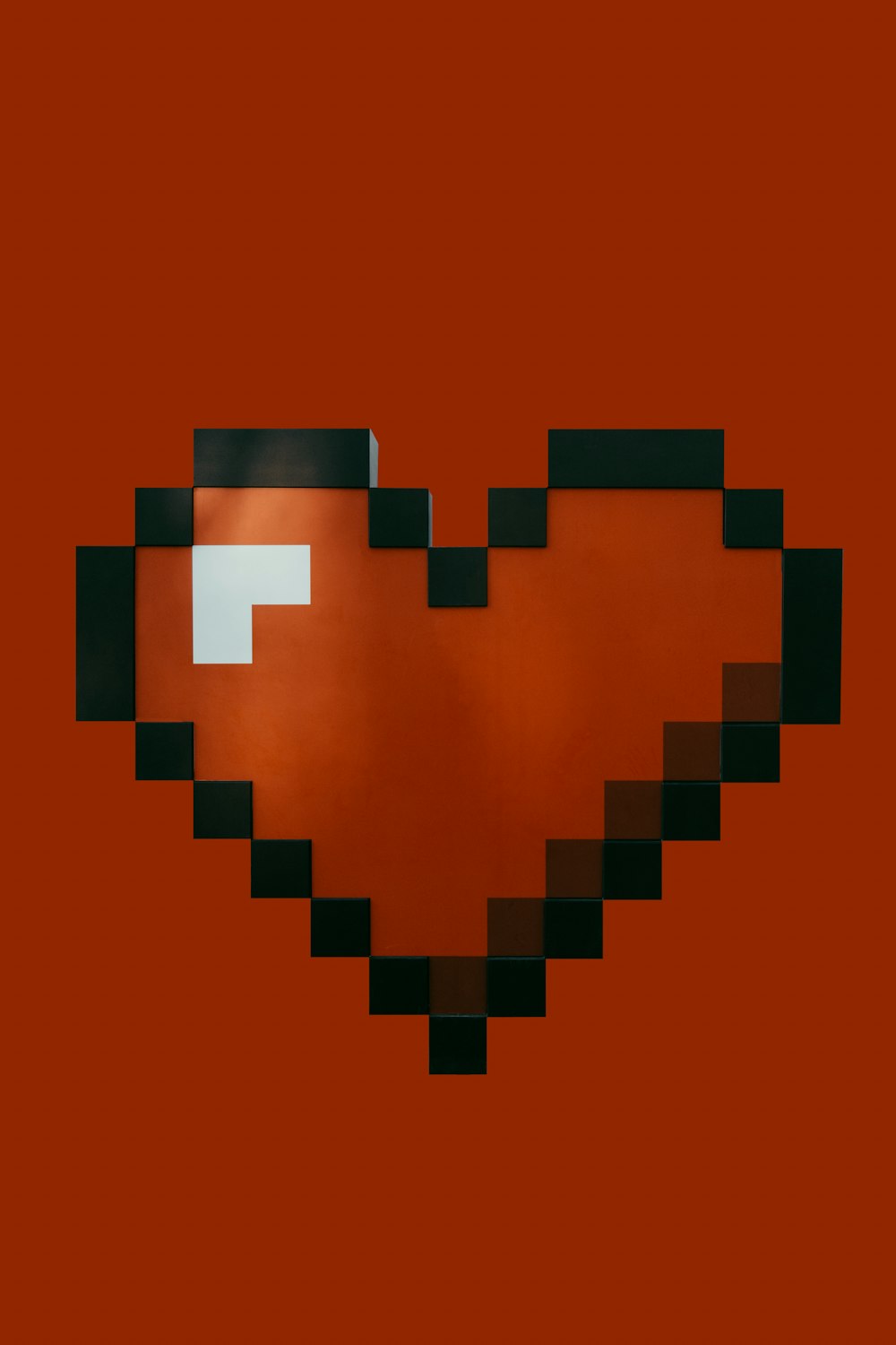 a heart shaped object with a red background