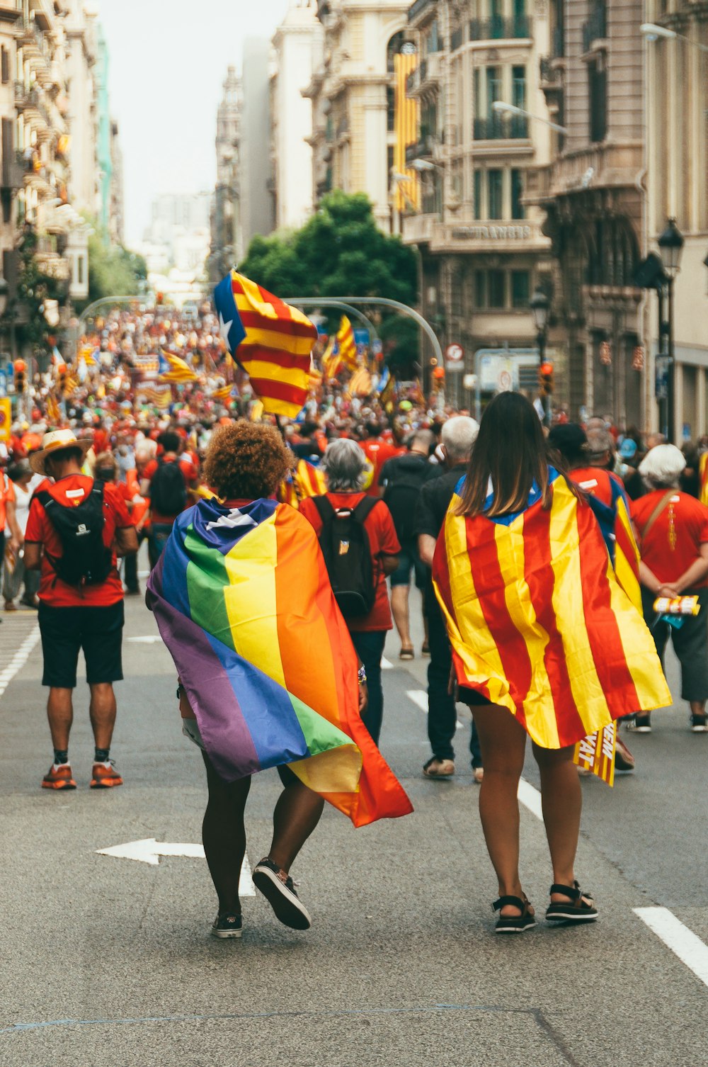 a large group of people walking down a street