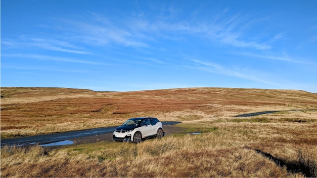 a car is parked on the side of a road