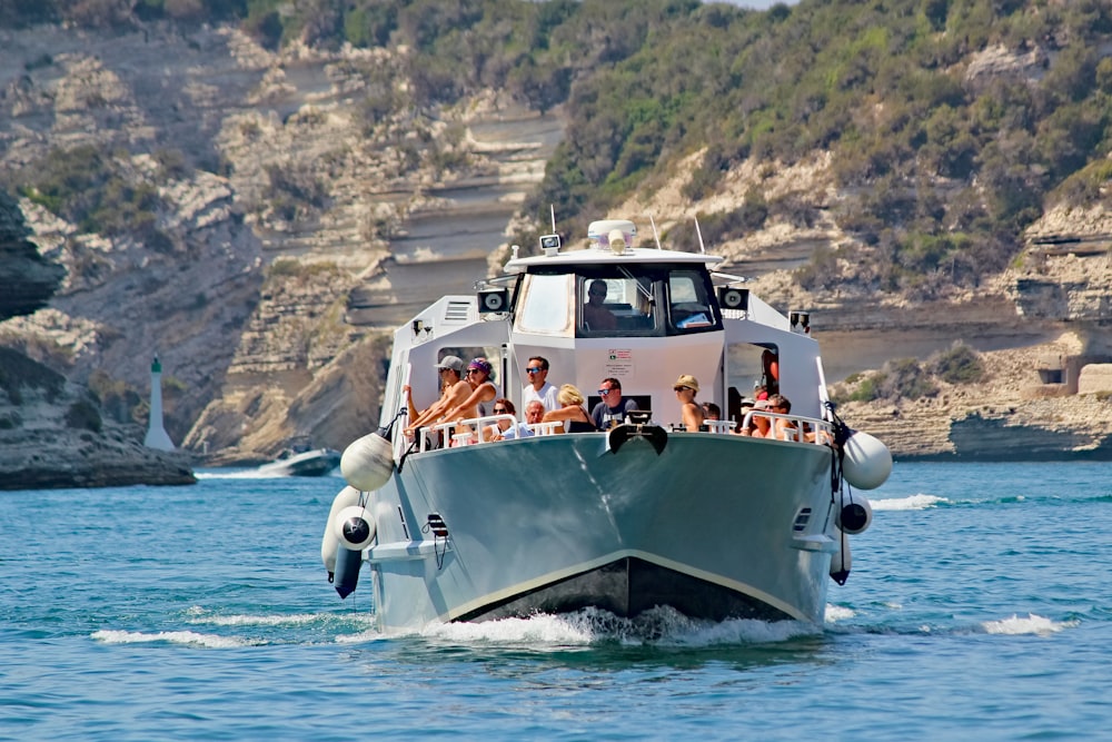 a boat full of people on a body of water