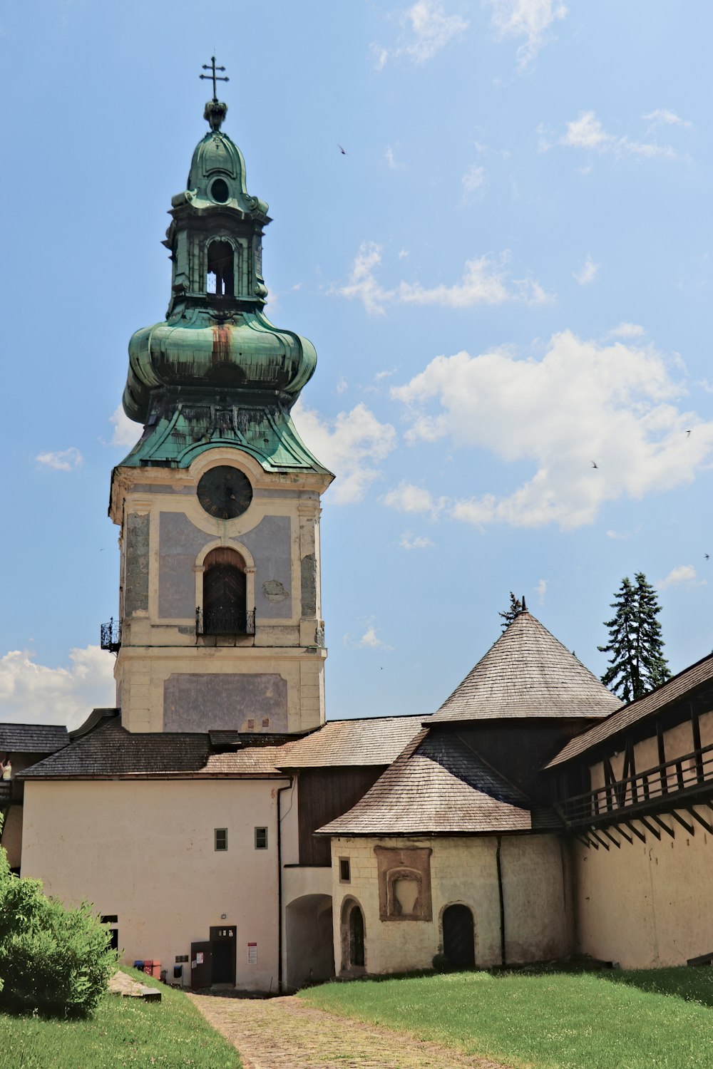 a large building with a tower with a clock on it