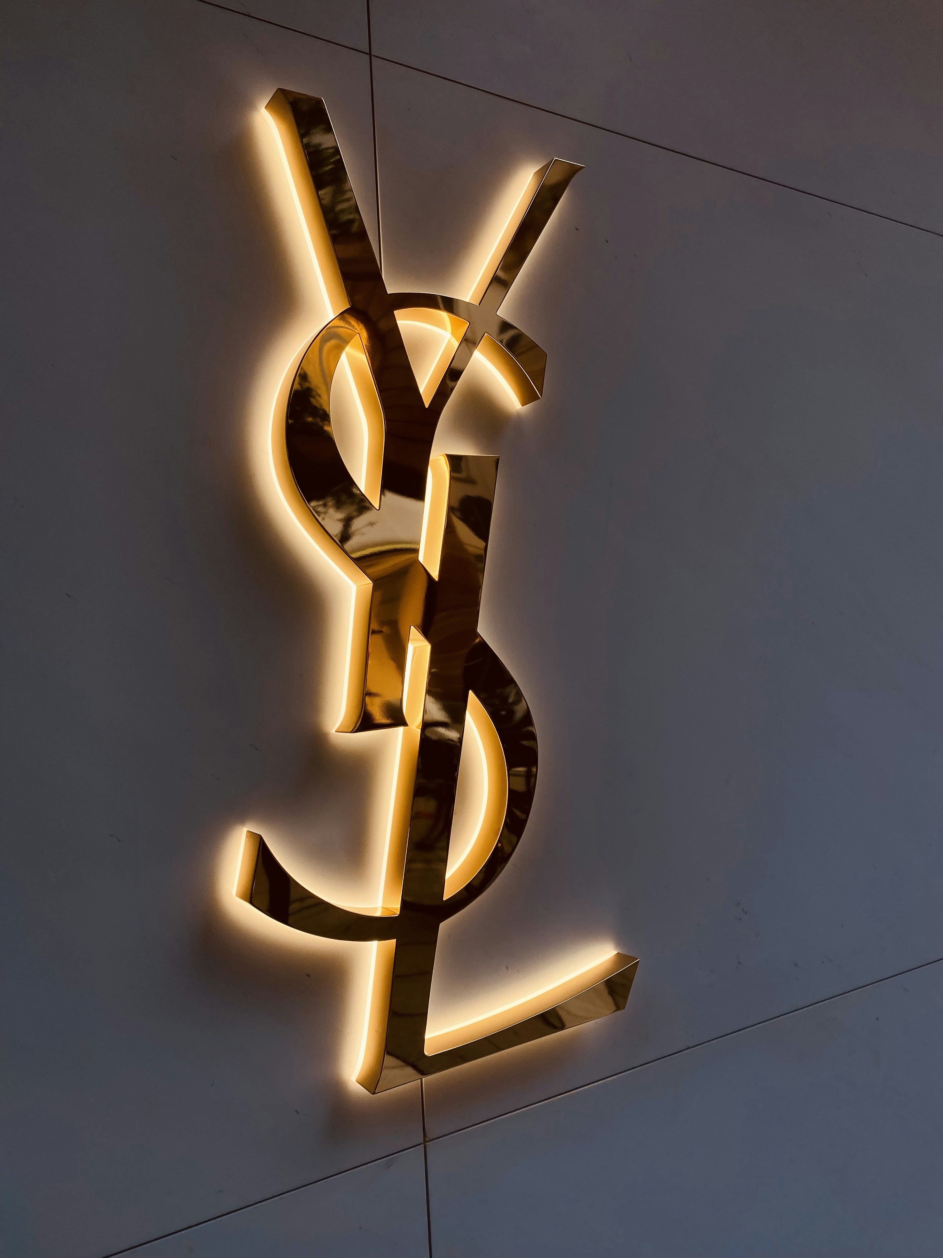 a lighted sign on the side of a building