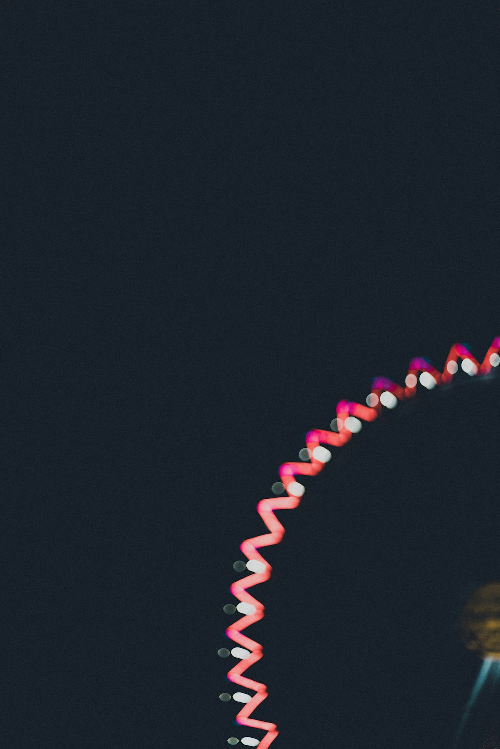 a ferris wheel is lit up at night