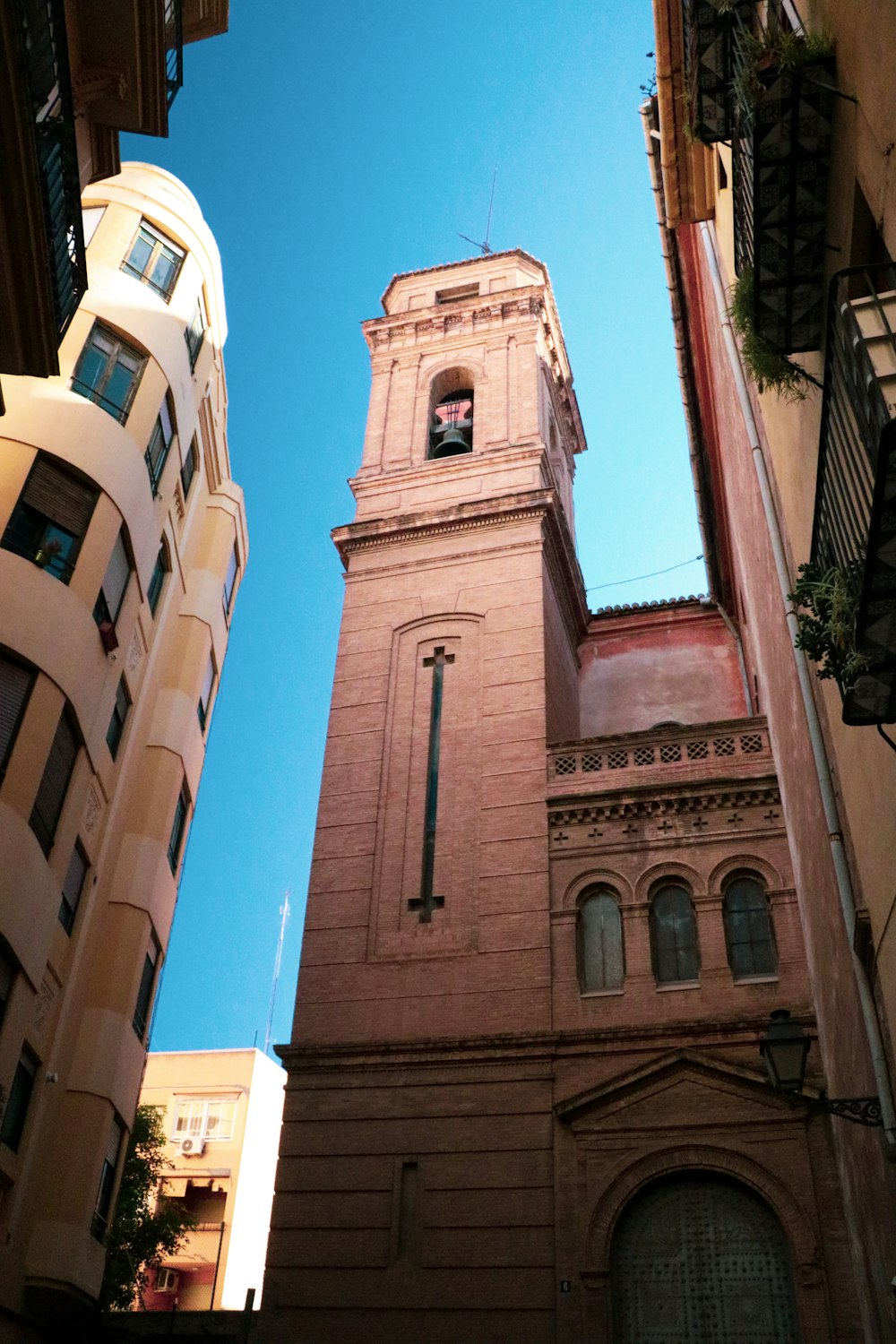 a tall clock tower towering over a city