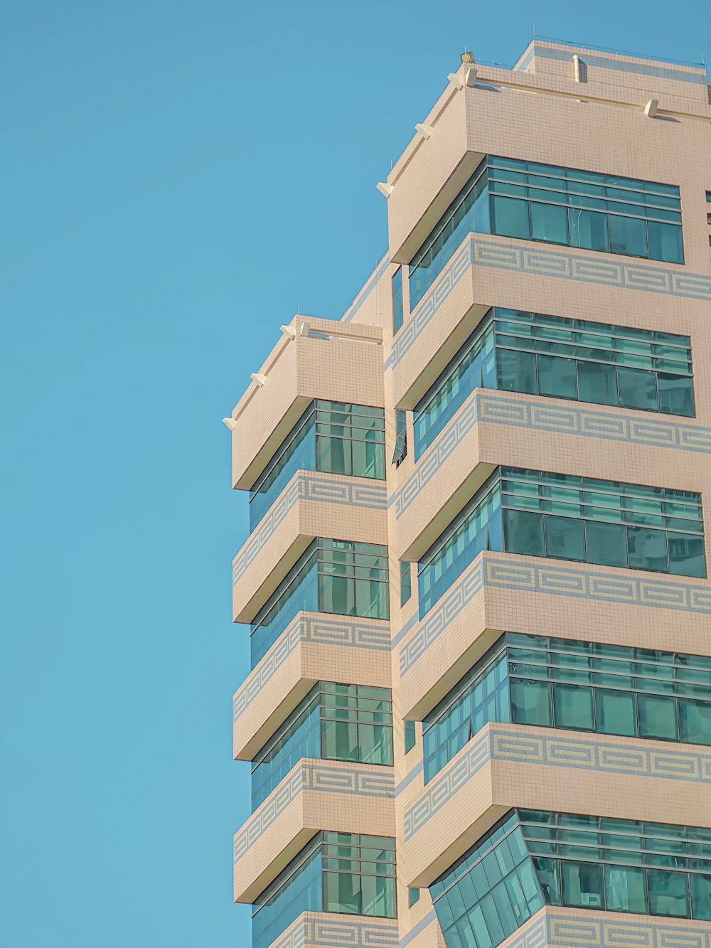 a tall building with a clock on the top of it