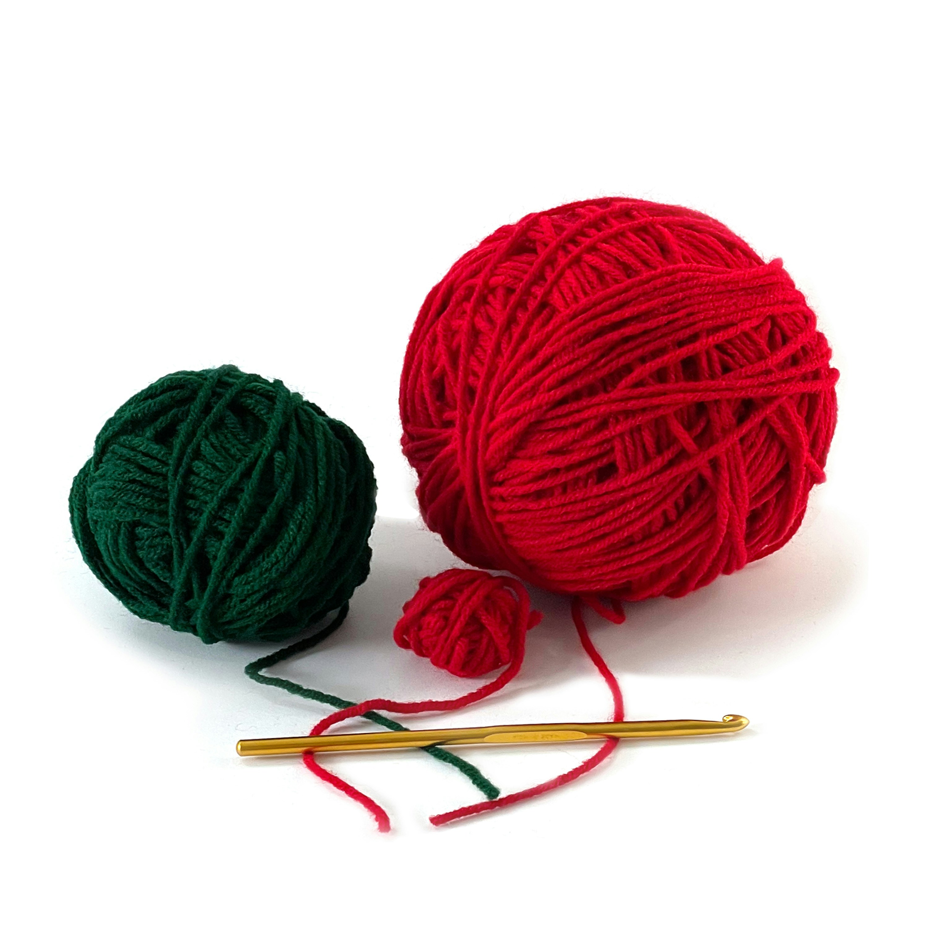 unravel: a ball of yarn next to a ball of knitting needles