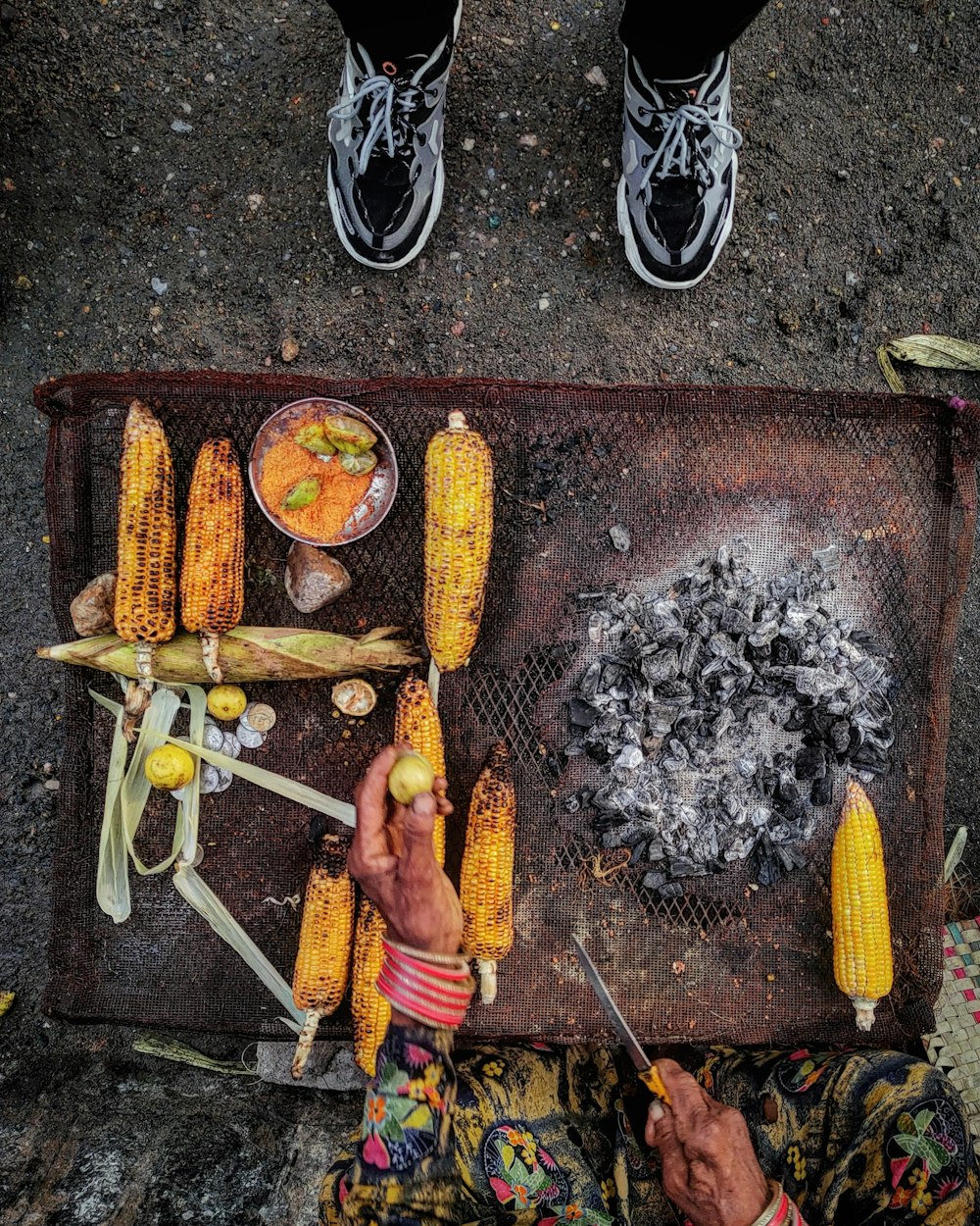 a person is preparing food on a grill