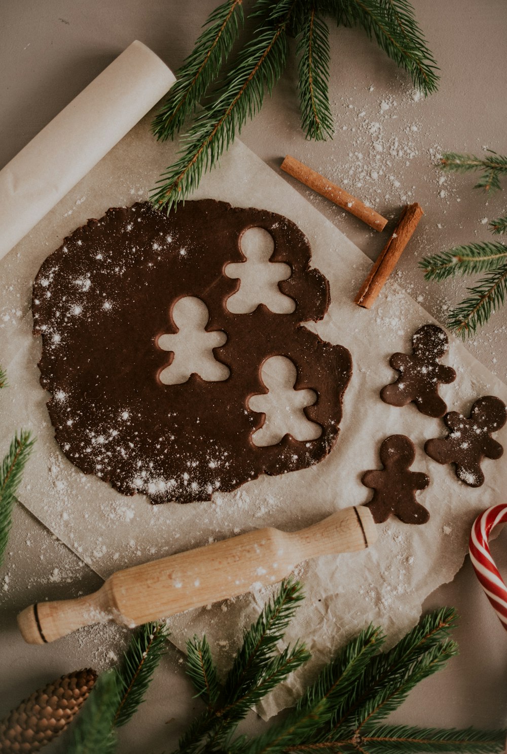 a cookie on a table next to a cookie cutter