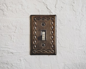 a light switch cover on a white wall