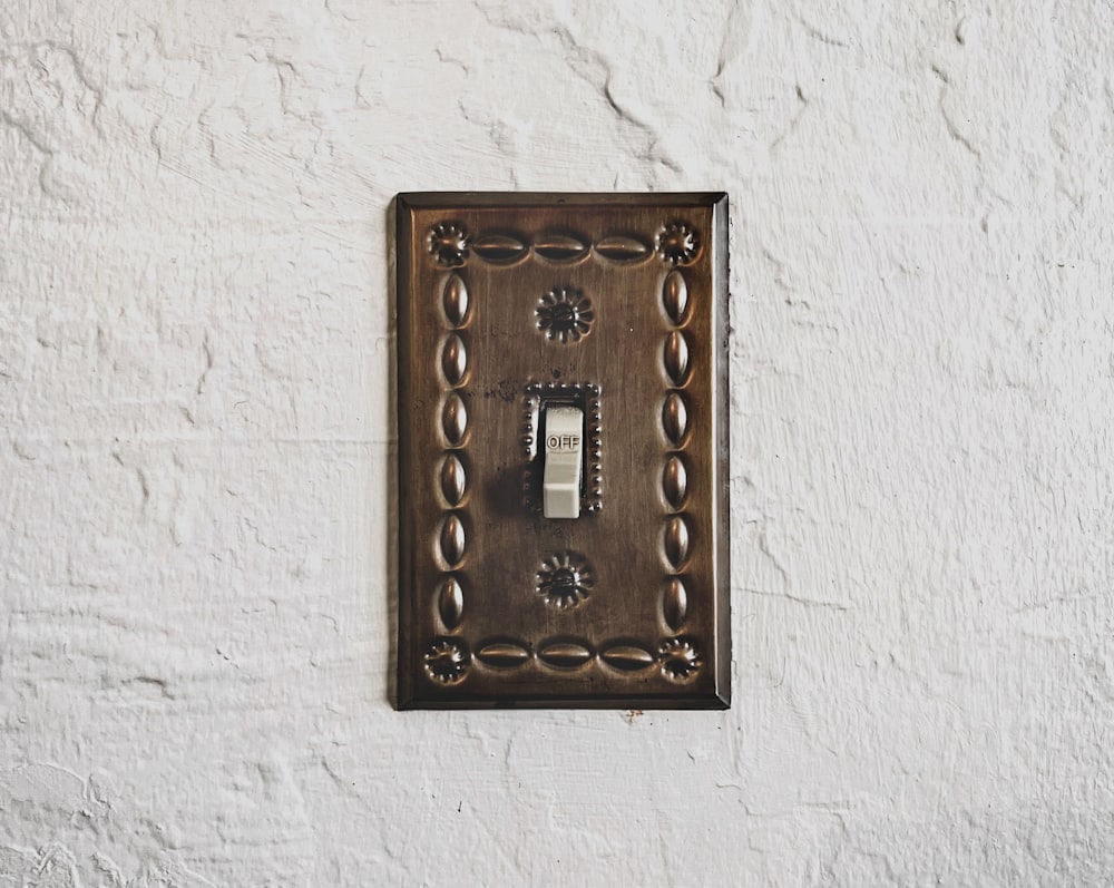 a light switch cover on a white wall