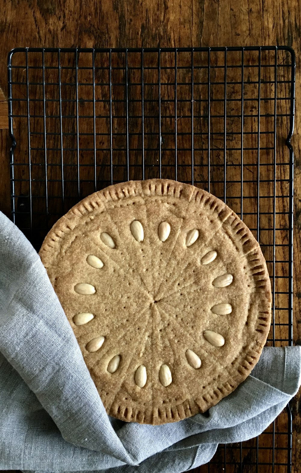 a cookie sitting on top of a cooling rack