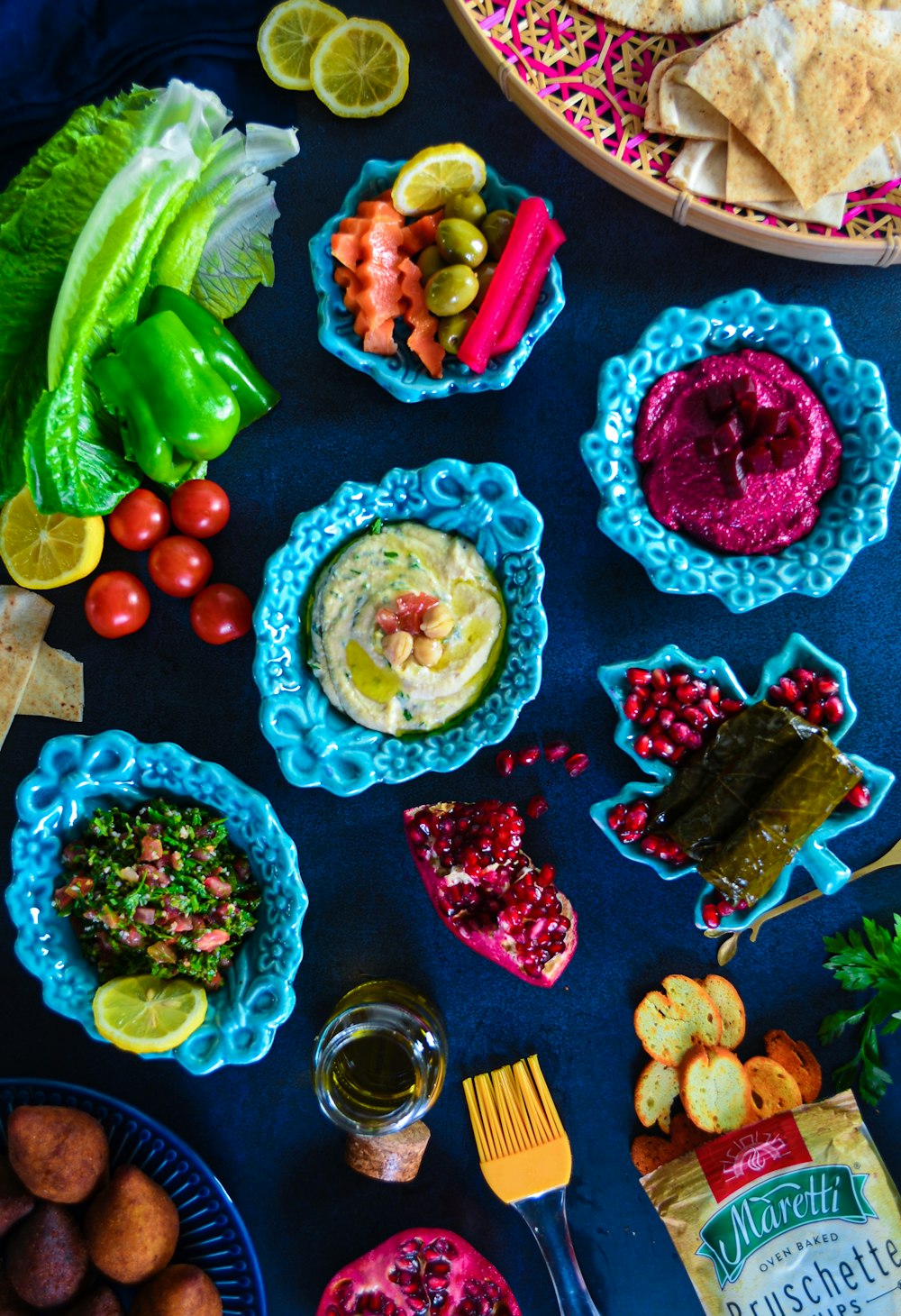 a table topped with plates and bowls of food