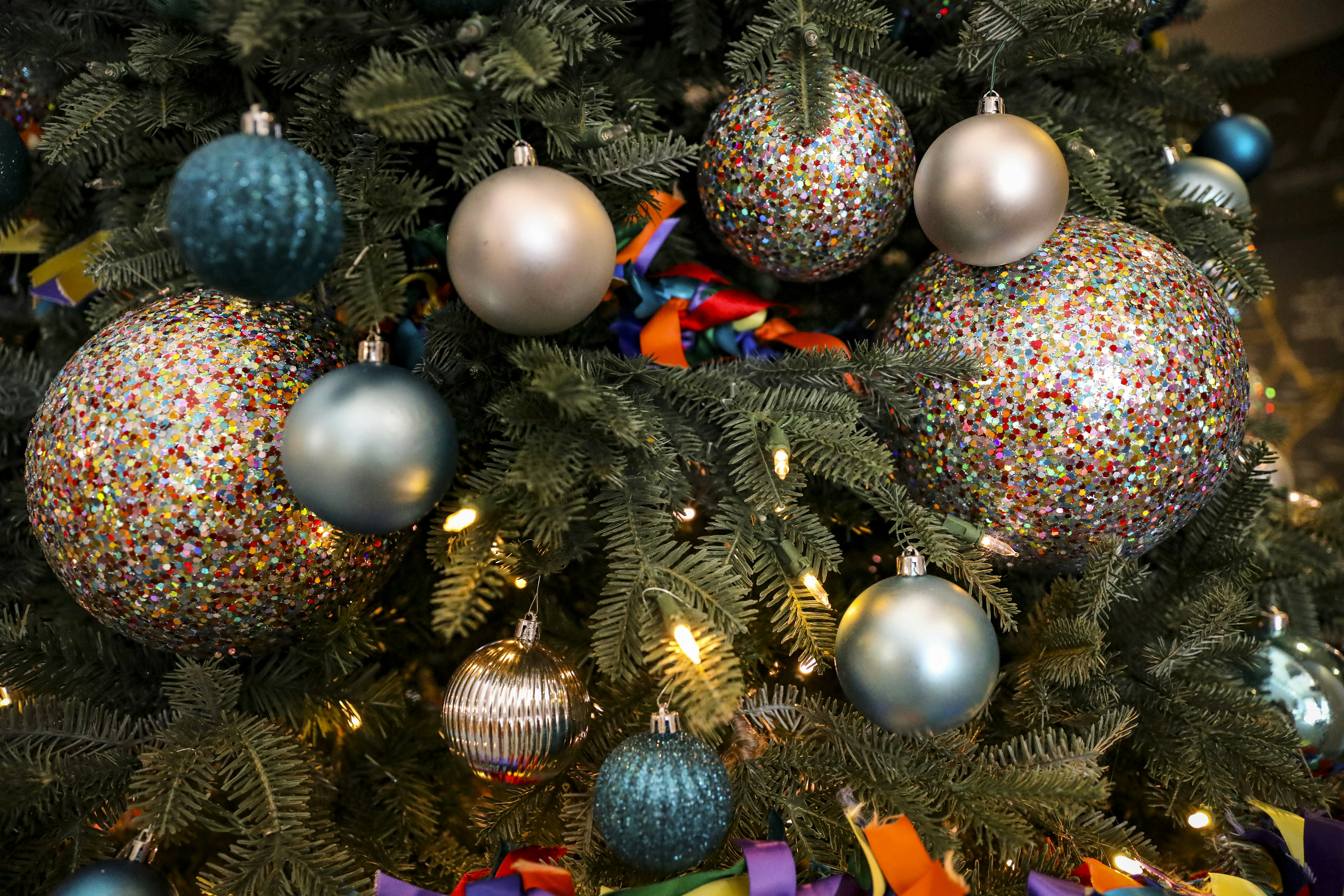 a close up of a christmas tree with ornaments