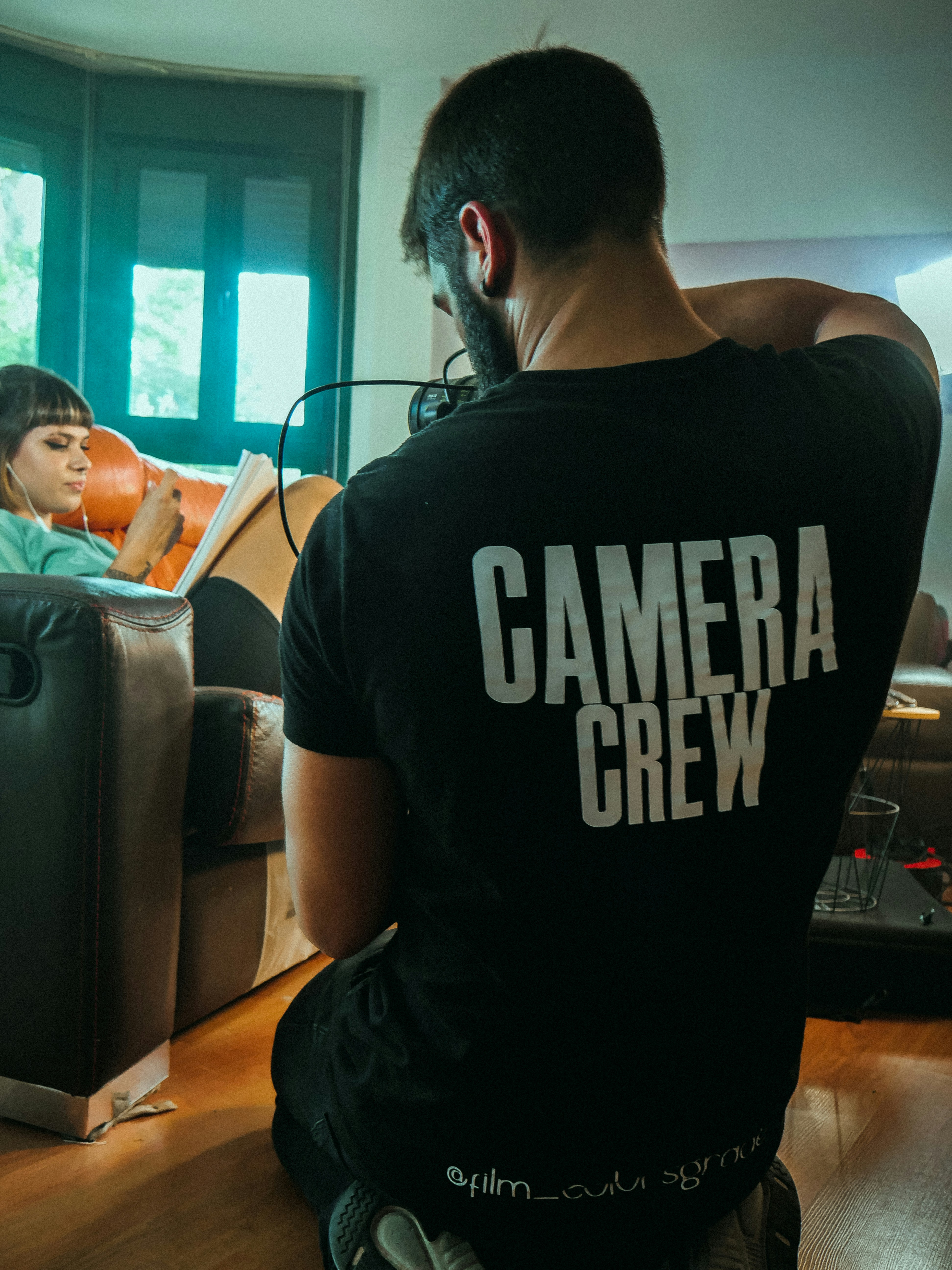 Camera crew member wearing a headset on set