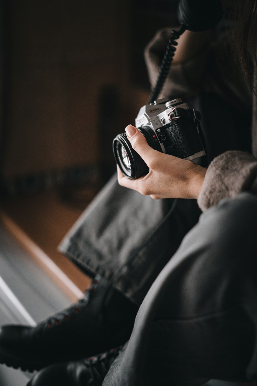 a person holding a camera in their hand