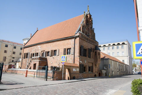 a large brick building with a steeple on top of it