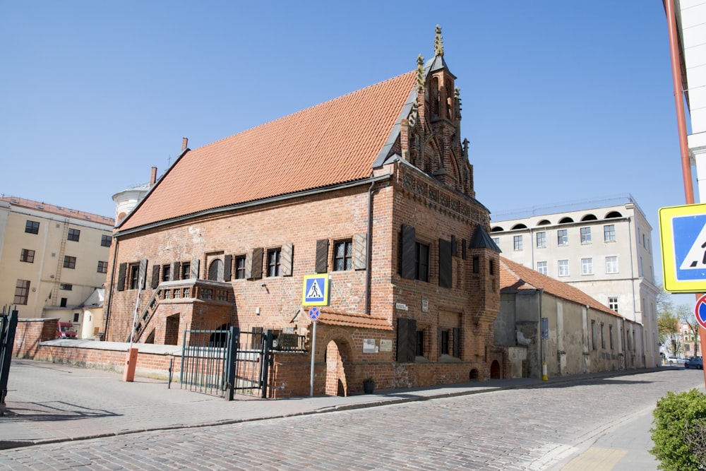 a large brick building with a steeple on top of it