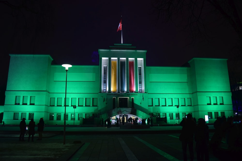 a large building with a flag on top of it