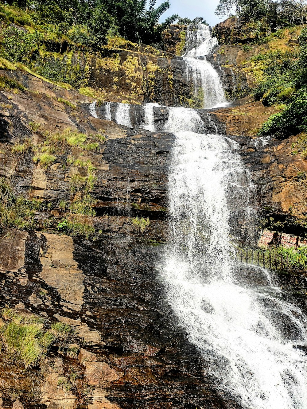 a large waterfall with lots of water coming out of it