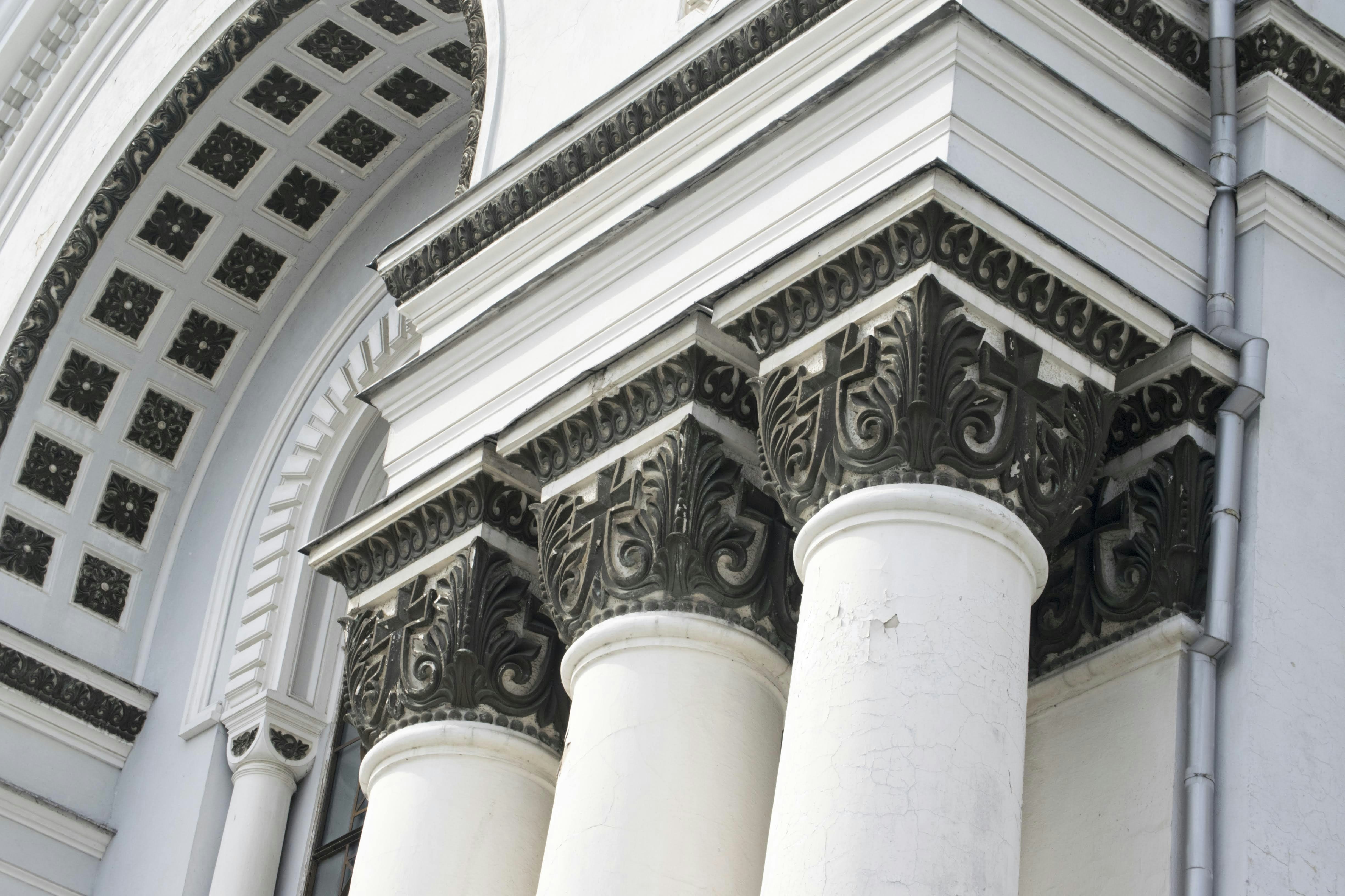 a close up of a building with columns and arches