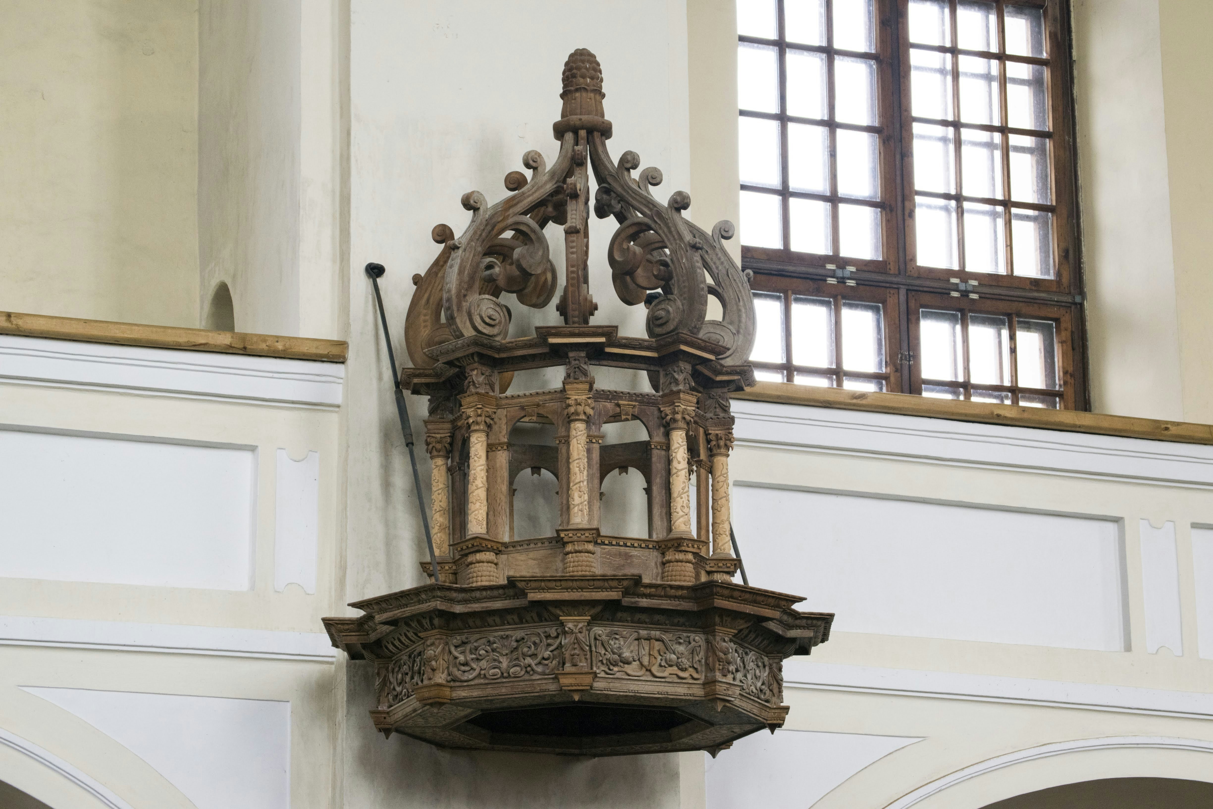 a clock mounted to the side of a wall