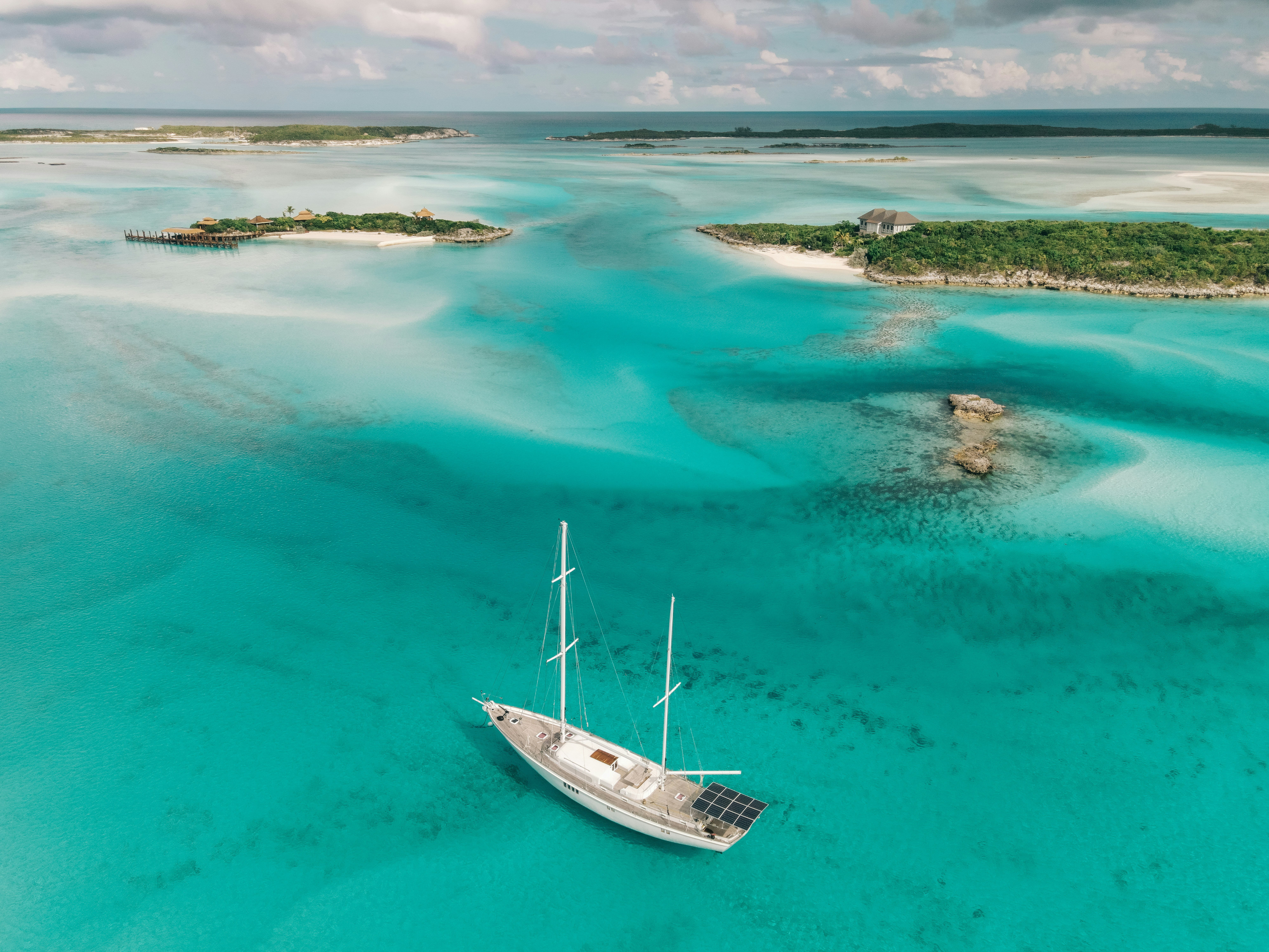a boat floating in the middle of a body of water