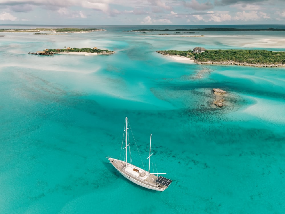 a boat floating in the middle of a body of water