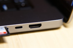 Close-up of a laptop’s ports and connectors, emphasizing the device’s excellent condition and functionality.