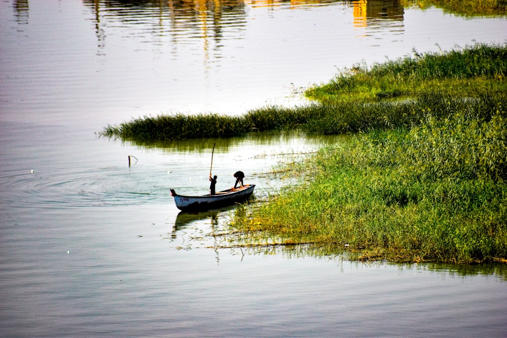 a person in a small boat on a body of water