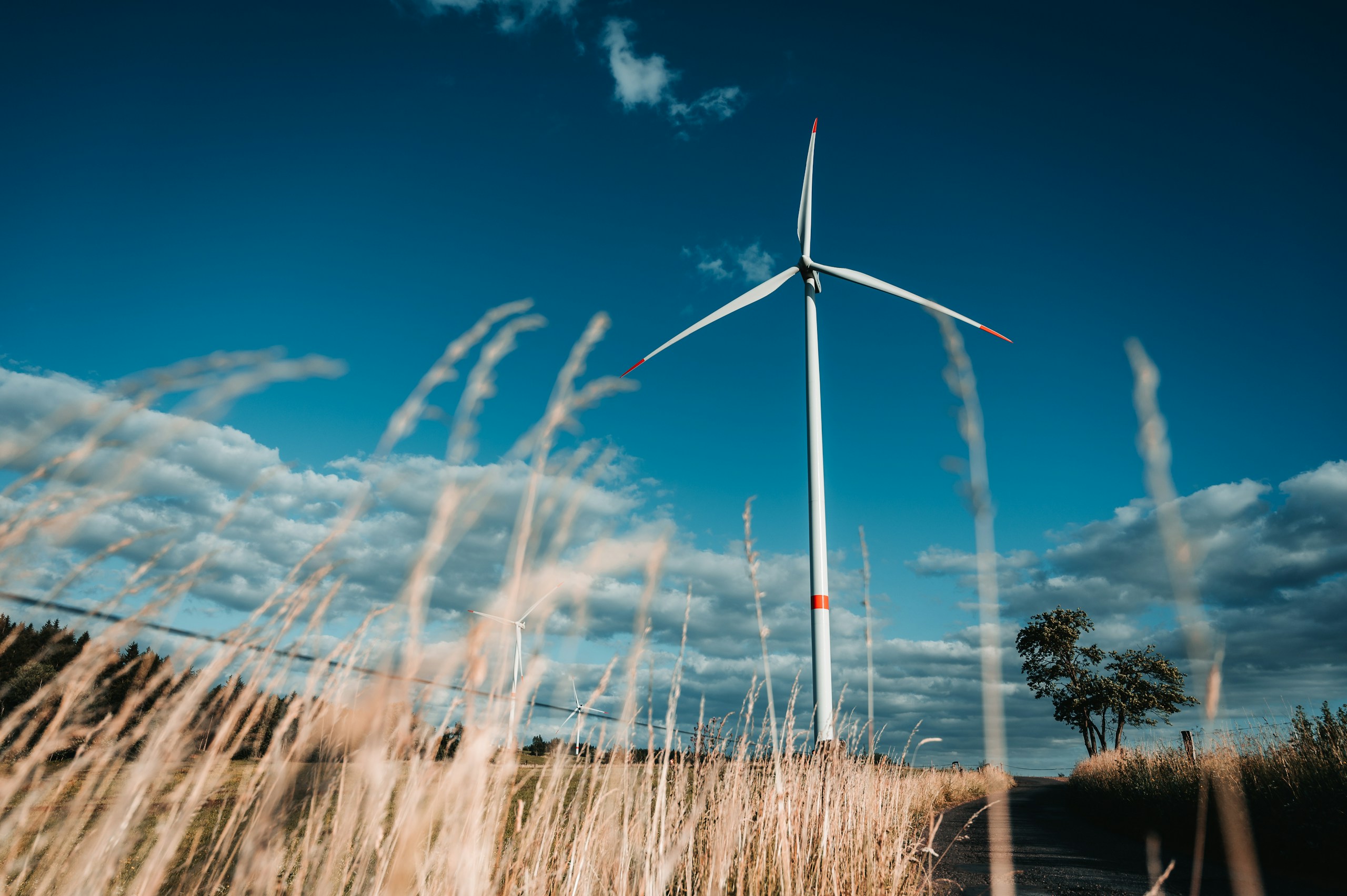 a wind turbine in the middle of a field