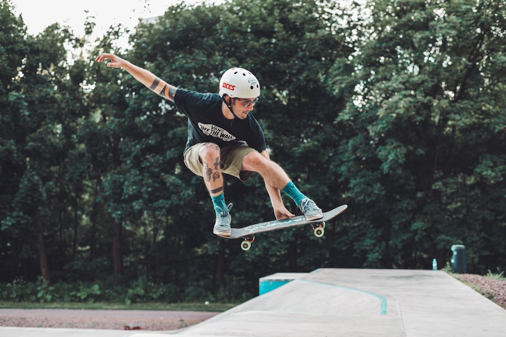 a man flying through the air while riding a skateboard