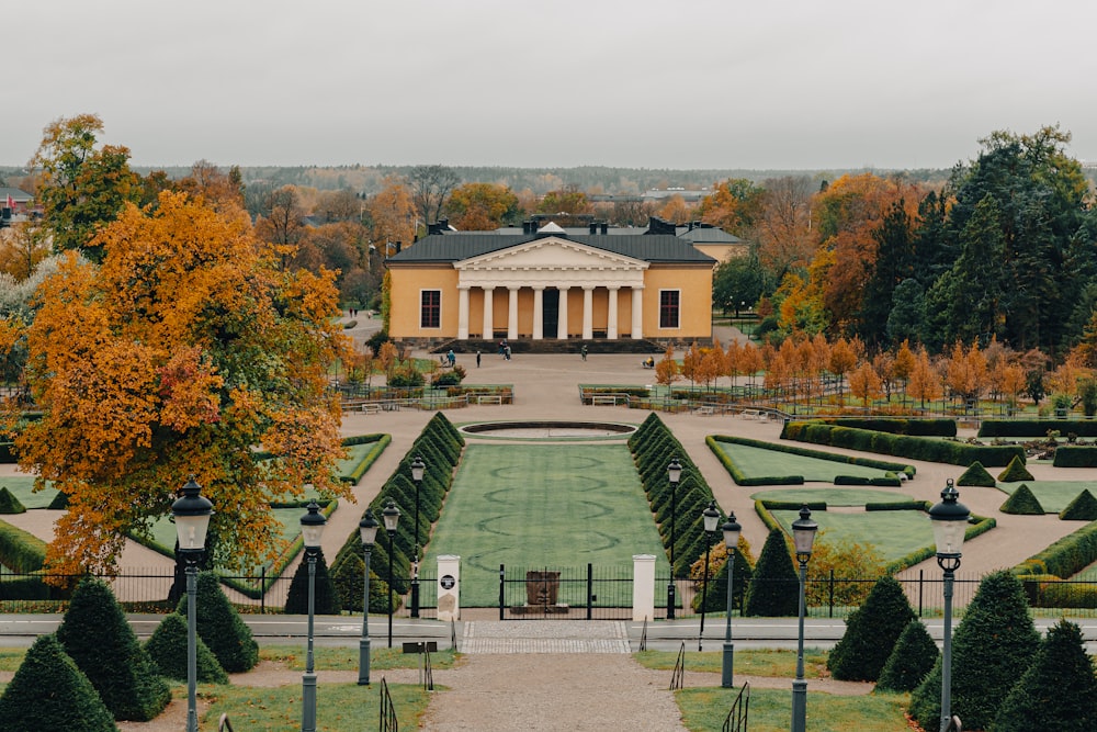 a view of a large building with a garden in front of it