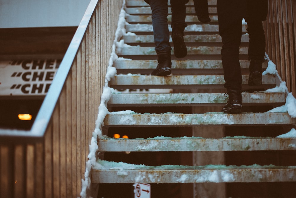 a group of people walking up a flight of stairs