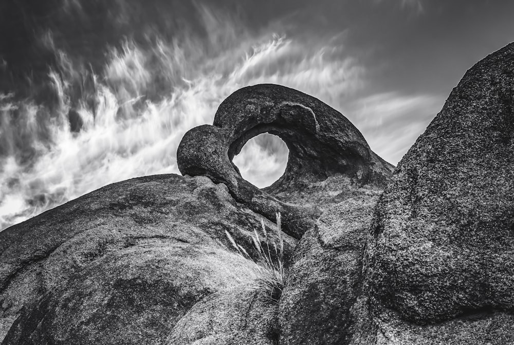 a black and white photo of a rock formation