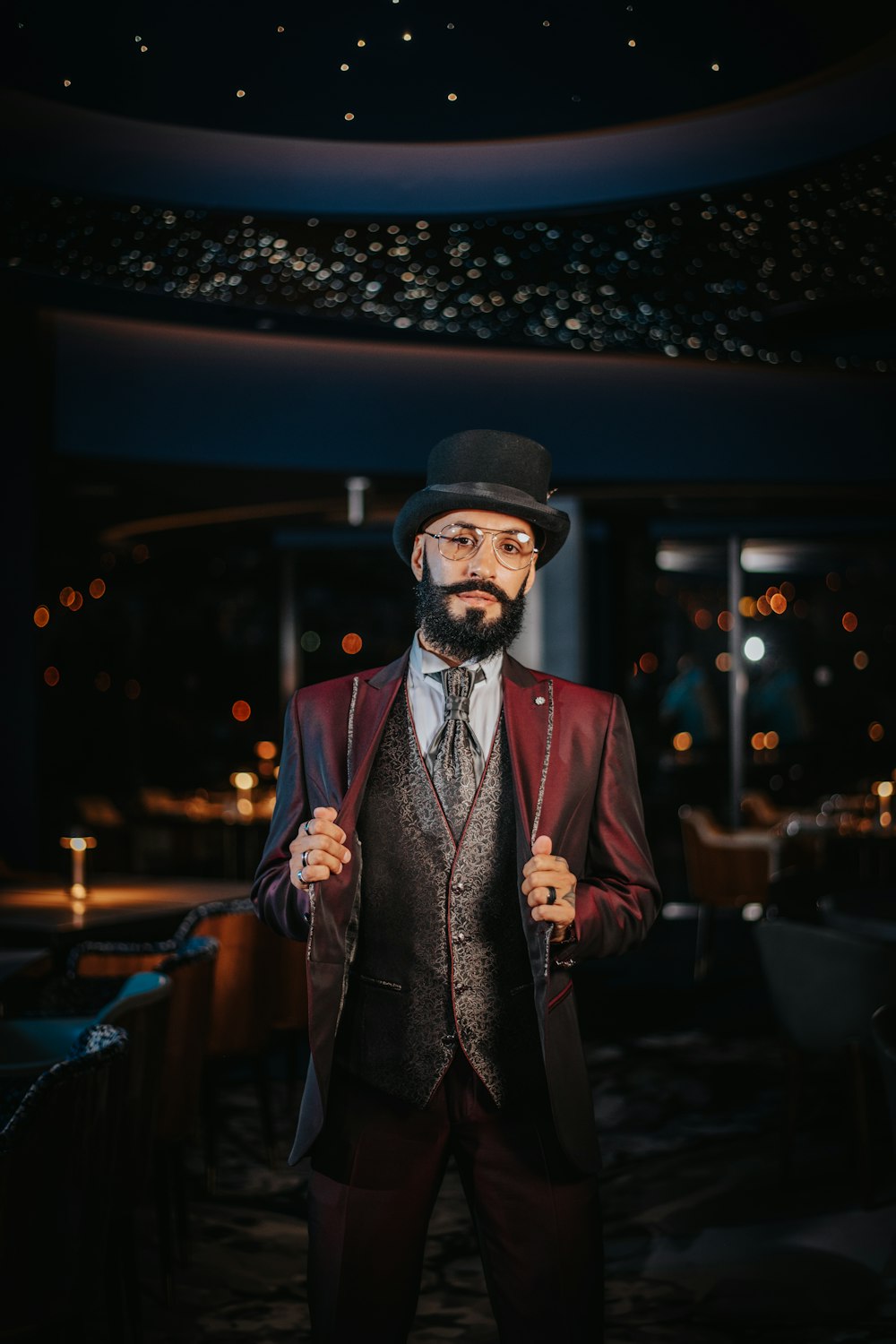 a man in a suit and tie standing in a room