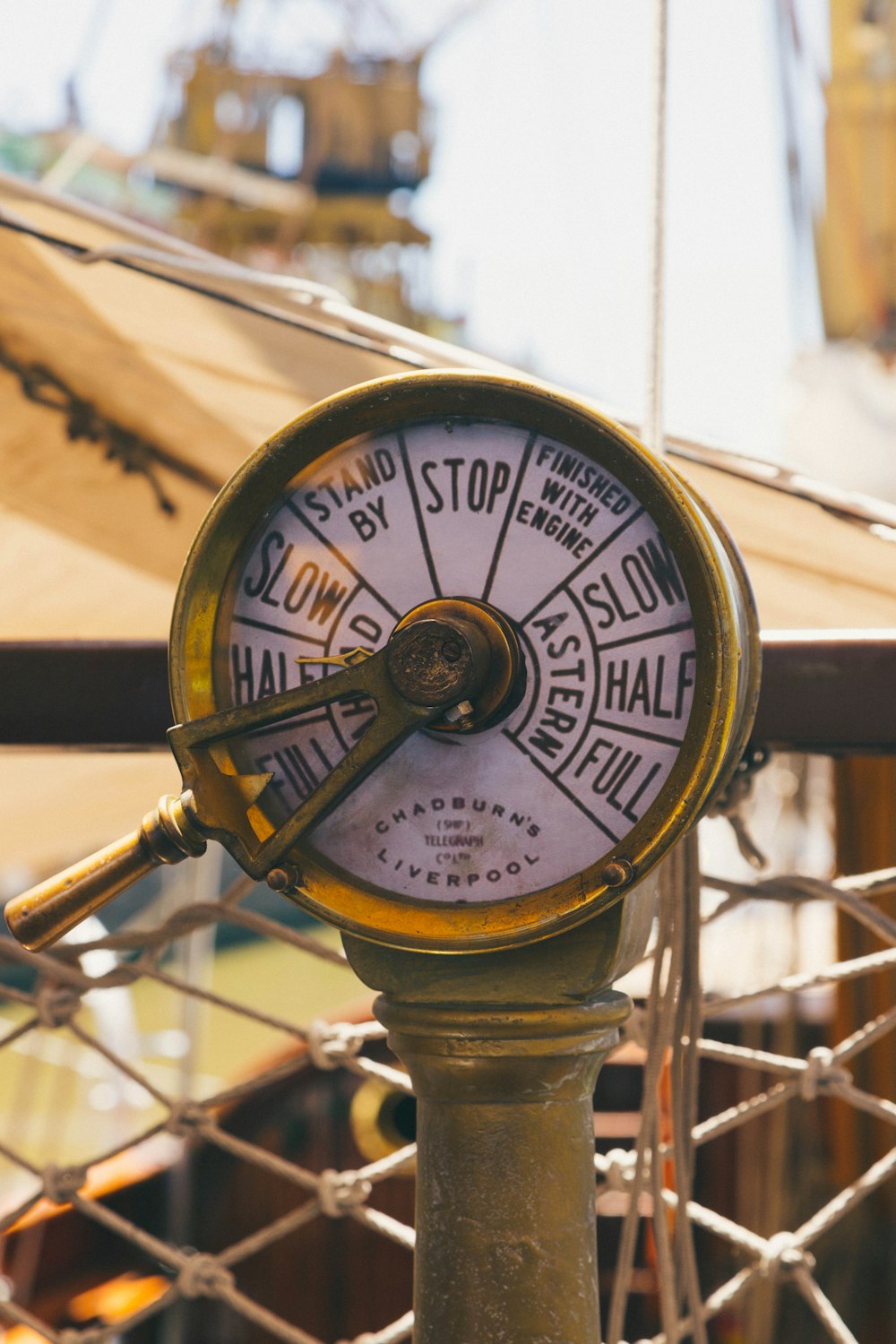 a close up of a clock on a pole