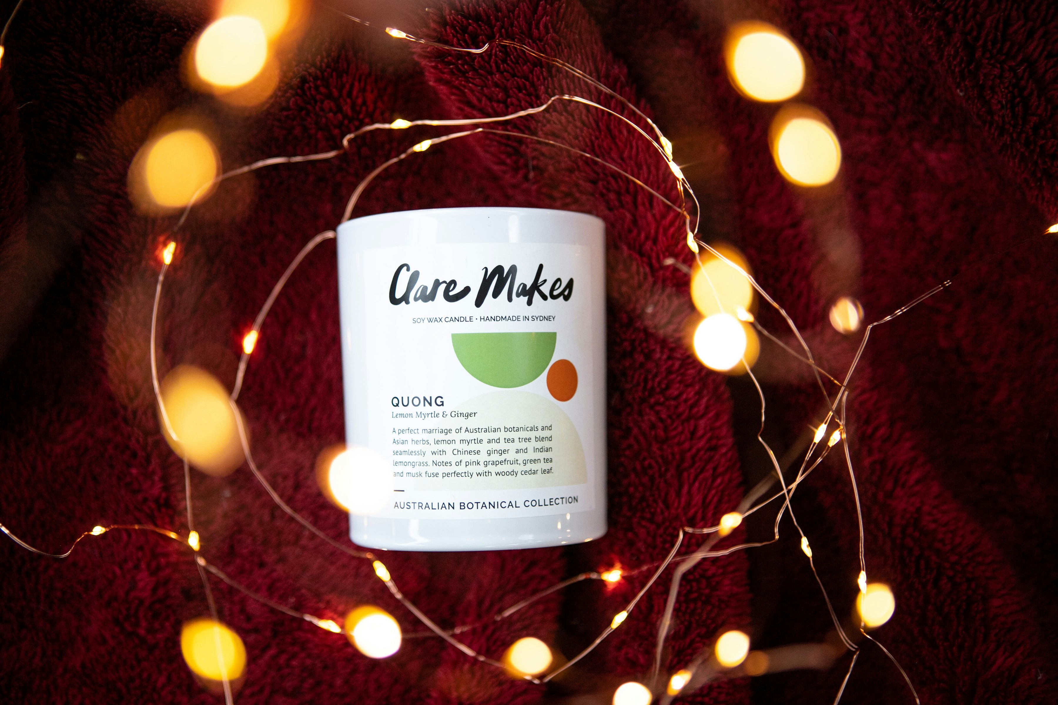 a cup of coffee with a string of lights around it