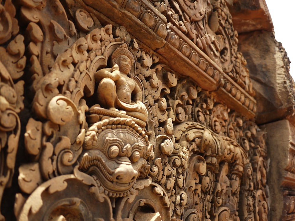 a close up of a carving on the side of a building