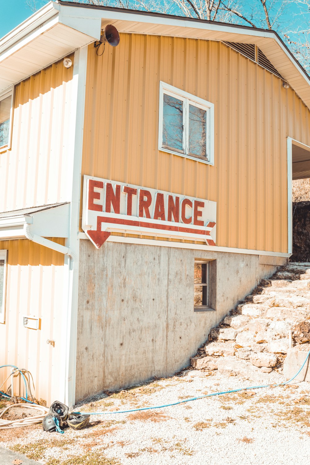 a building with a sign that says entrance on it